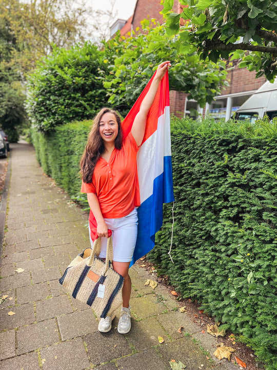 Shop je oranje outfit.